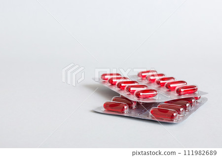 too many different pill cartridges stacked. selective Focus. Packs of blister pills with tablets. Colored pastilles packages. A pile of medicine in blister packs. Pharmaceutical blister packs 111982689