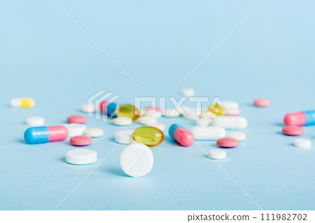 Many different colorful medication and pills perspective view. Set of many pills on colored background 111982702