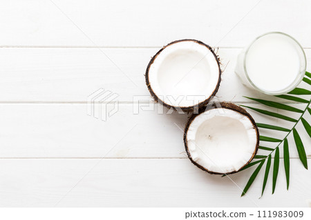 coconut products on white wooden table background. Dairy free milk substitute drink, Flat lay healthy eating 111983009