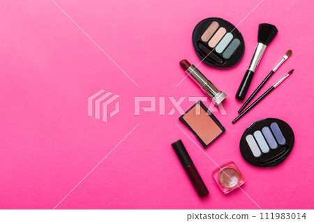 Professional makeup tools. Top view. Flat lay. Beauty, decorative cosmetics. Makeup brushes set and color eyeshadow palette on table background. Minimalistic style 111983014