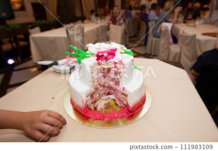 Beautiful cut cake on a restaurant background. Beautiful cut cake on a restaurant background. 111983109