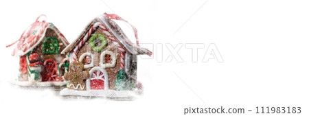 New Year banner. Gingerbread man on the background of a fabulous house. New Year banner. Gingerbread man on the background of a fabulous house. 111983183
