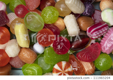 Many sweets. Multi-colored caramel close-up. Sweets. Many sweets. Multi-colored caramel close-up. Sweets. 111983204