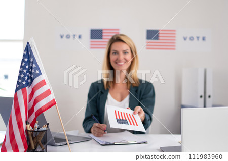 Member of electoral commission in polling place on election day, usa elections. 111983960
