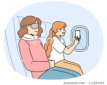 Smiling girl make clouds picture from plane window Smiling girl make clouds picture from plane window 111984393