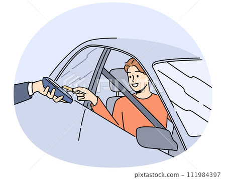 Smiling man in car pay with card on terminal 111984397