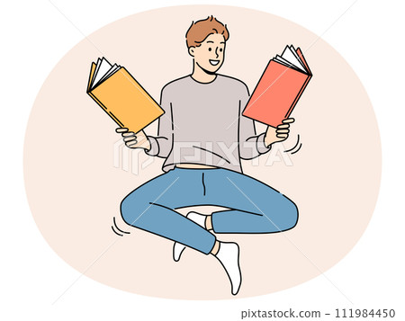 Smiling man floating in air reading books Smiling man floating in air reading books 111984450