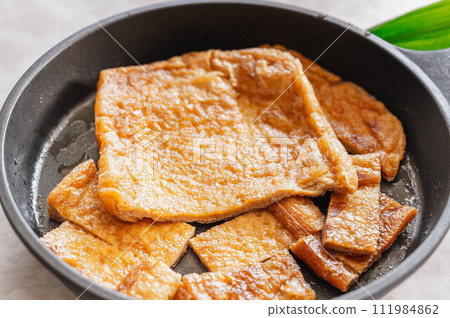 Juicy fried stew made in a skillet 111984862