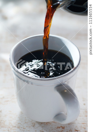 pour coffee into a mug pour coffee into a mug 111985554