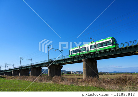 Chikuho Electric Railway Type 5000 crossing the Onga River 111985918
