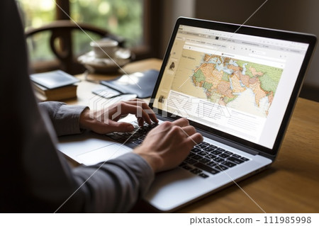 Tourist planning vacation use laptop for search and check hotel and travel accessories on table Tourist planning vacation use laptop for search and check hotel and travel accessories on table 111985998