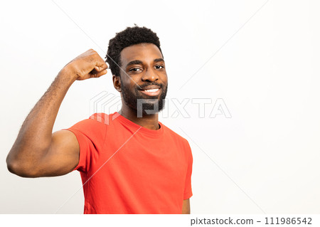 Confident African American Man Smiling in Casual Red Shirt Confident African American Man Smiling in Casual Red Shirt 111986542