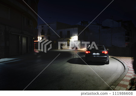 A car on the street at night in the city of Quesada in the province of Jaen. Transportation. Travel and tourism concept 111986608