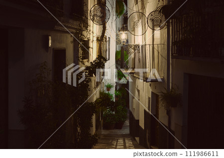 Calle Adentro at night, the most beautiful and famous street in the city of Quesada in the province of Jaen. 111986611