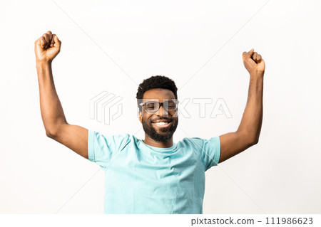 Cheerful African American Man Celebrating Success Isolated on White Cheerful African American Man Celebrating Success Isolated on White 111986623