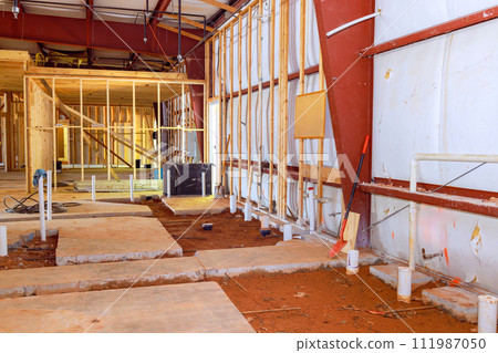 Lavatory restroom plumbing exposed drainage pvc pipe endings in concrete floor Lavatory restroom plumbing exposed drainage pvc pipe endings in concrete floor 111987050