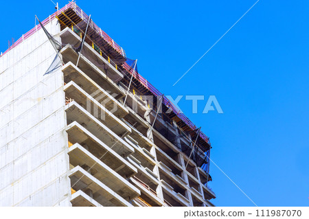 On construction site of large American city, new skyscraper buildings are currently being constructed On construction site of large American city, new skyscraper buildings are currently being constructed 111987070