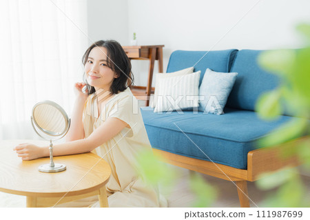 A young woman feels her skin become more moisturized 111987699