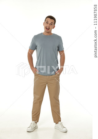 surprised guy looking at camera on white studio background 111987858