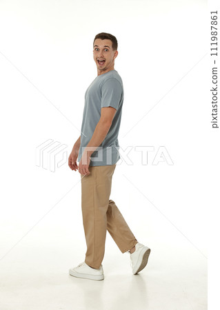 surprised guy looking at camera on white studio background surprised guy looking at camera on white studio background 111987861