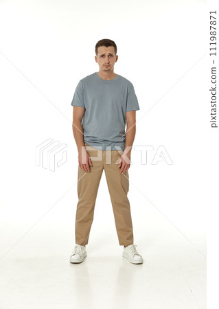 offended frustrated young man on white background. sadness 111987871
