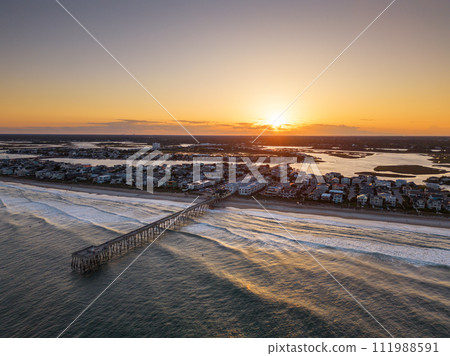 Wrightsville Beach, North Carolina over the coast at sunset. 111988591