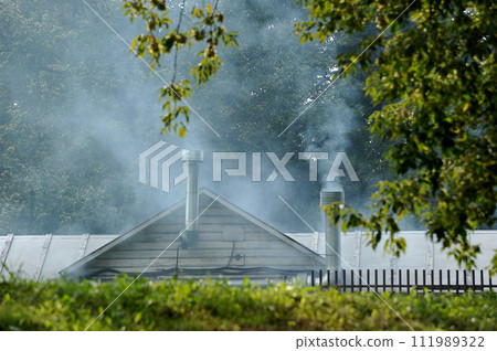 smoke from the kitchen chimneys 111989322