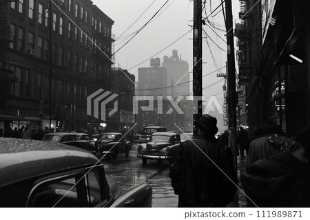 Black and white photo of a street with cars and high-rise buildings 111989871