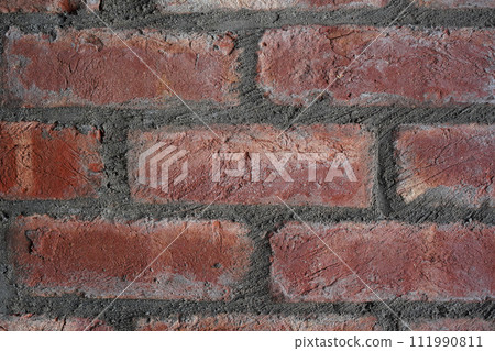 Red brick wall texture background. Rough, hard surface construction backdrop. Horizontal photo. Close-up. Industrial concept design. 111990811