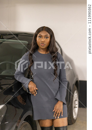 Confident Black Female Entrepreneur with Luxury Car Confident Black Female Entrepreneur with Luxury Car 111990862