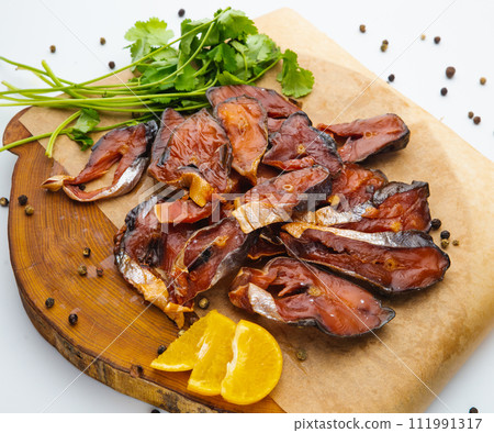 Salmon slices isolated on white background with clipping path, cubes of red fish with rosemary and peppercorns, ingredient for sushi or salad, macro Salmon slices isolated on white background with clipping path, cubes of red fish with rosemary and peppercorns, ingredient for sushi or salad, macro 111991317