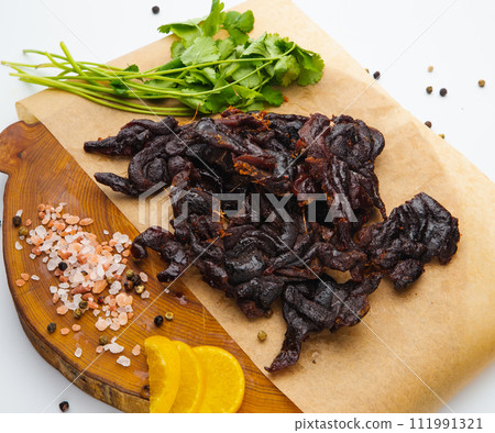Peeled sun-creamfish with delicious caviar lies on a white plate 111991321