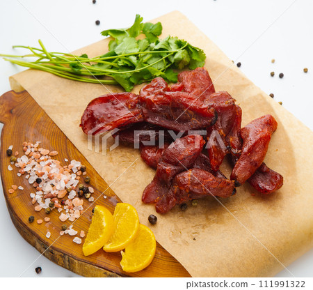 Peeled sun-creamfish with delicious caviar lies on a white plate 111991322