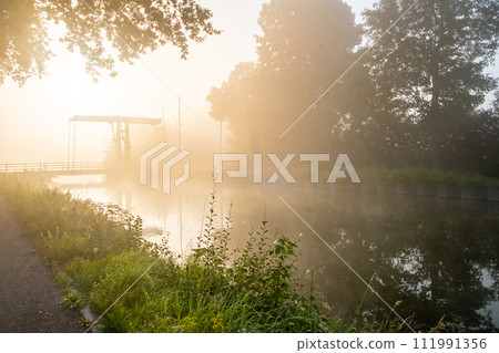 Misty Dawn at the Riverside 111991356