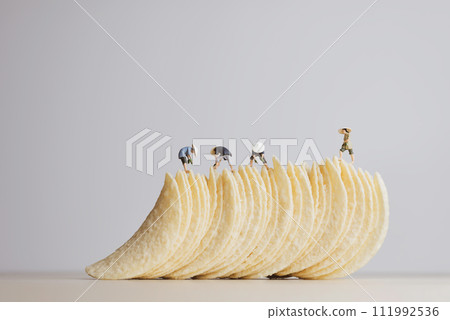 Potato chips making concept. Macro photo 111992536