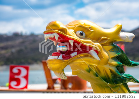 Carved and painted dragon head of a Dragonboat 111992552