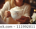 AI-generated content. White beautiful cup with a hot drink and whipped cream in children's hands 111992811