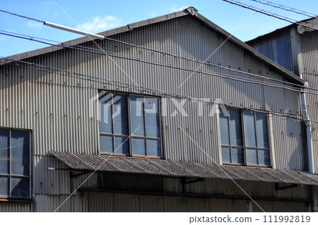 Factory exterior (corrugated slate exterior wall) Factory exterior (corrugated slate exterior wall) 111992819