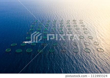 Aerial view of fish farm in Mediterranean sea 111993324
