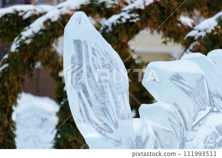 Snow sculpture, frozen in a dynamic and action-packed pose. Snow sculpture, frozen in a dynamic and action-packed pose. 111993511