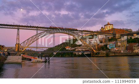 Picturesque view of old town Porto, Portugal with bridge Ponte Dom Luis over Douro river. 111994059