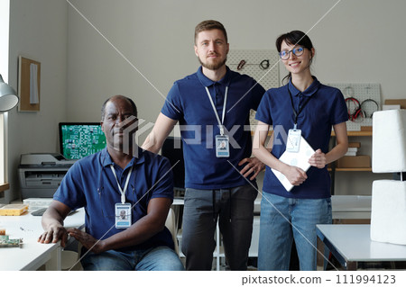 Professional technicians in blue uniform Professional technicians in blue uniform 111994123