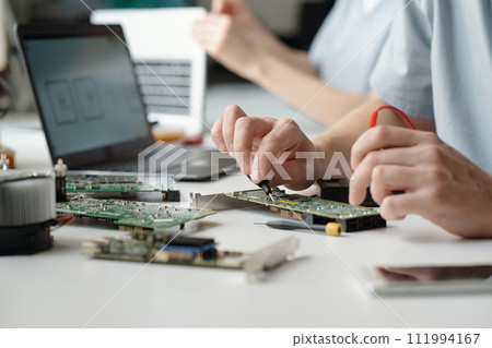 Hands of repair service center engineer Hands of repair service center engineer 111994167