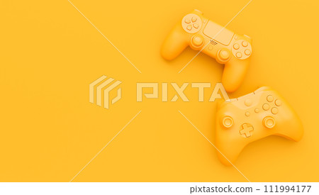 Video game joysticks or gamepads in plain monochrome yellow color background 111994177