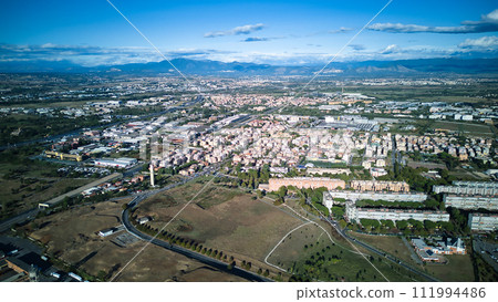 The aerial view showcases a cityscape filled with an abundance of lush green trees, providing a refreshing sight amidst the urban environment. The trees are scattered throughout the city, lining The aerial view showcases a cityscape filled with an abundance of lush green trees, providing a refreshing sight amidst the urban environment. The trees are scattered throughout the city, lining 111994486