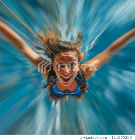 Adventure holiday. Selfie shot during bungee jumping. Ropejumping woman having fun, extreme sports concept, embracing freedom, excitement and adrenaline rush. 111995260