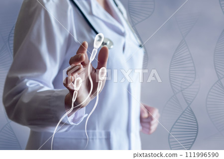 The doctor shows the spermatozoon. 111996590