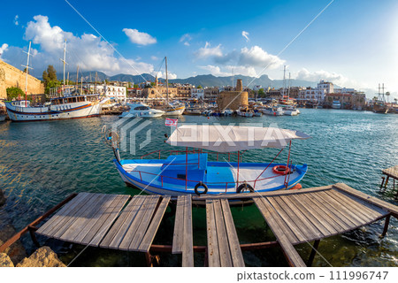 Tiny old boat moored in Kyrenia harbor. Cyprus Tiny old boat moored in Kyrenia harbor. Cyprus 111996747