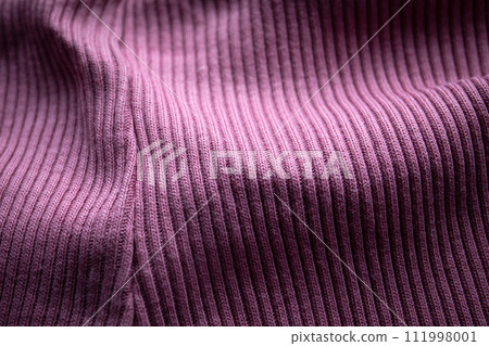 Close-up of purple knit with seam, ribbed, distinct texture, curved fabric 111998001