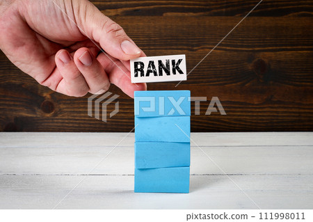 Rank Concept. Blue blocks on wood texture background Rank Concept. Blue blocks on wood texture background 111998011